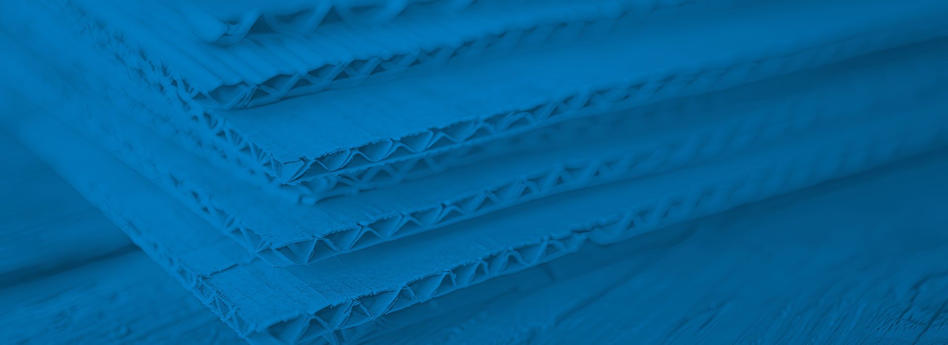 sheets of corrugated cardboard with a blue overlay